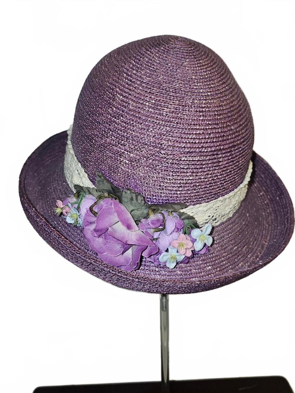 Purple cloche hat with floral trim